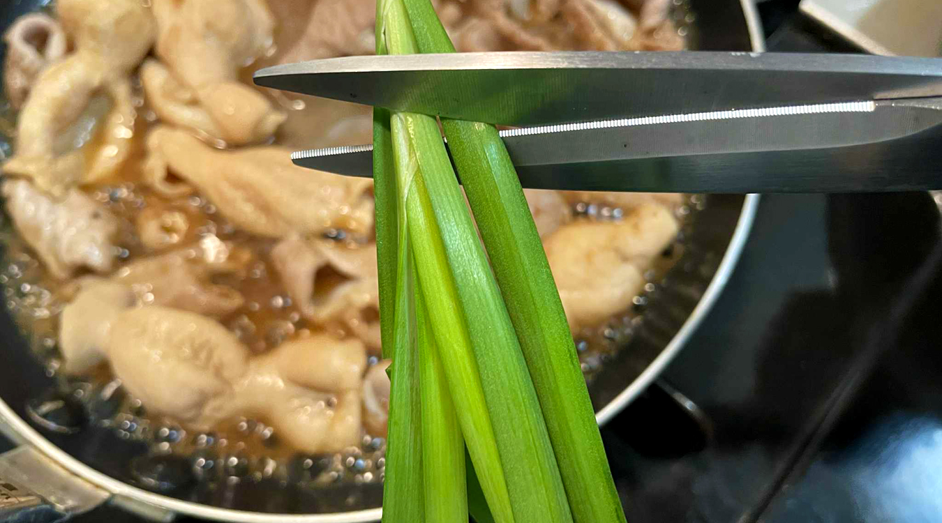 adding_chives_cut_with_scissors